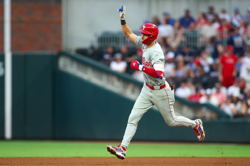 Jul 5, 2024; Atlanta, Georgia, USA; Philadelphia Phillies shortstop Trea Turner (7) celebrates with teammates after a two-run home run against the Atlanta Braves in the fourth inning at Truist Park. Mandatory Credit: Brett Davis-USA TODAY Sports