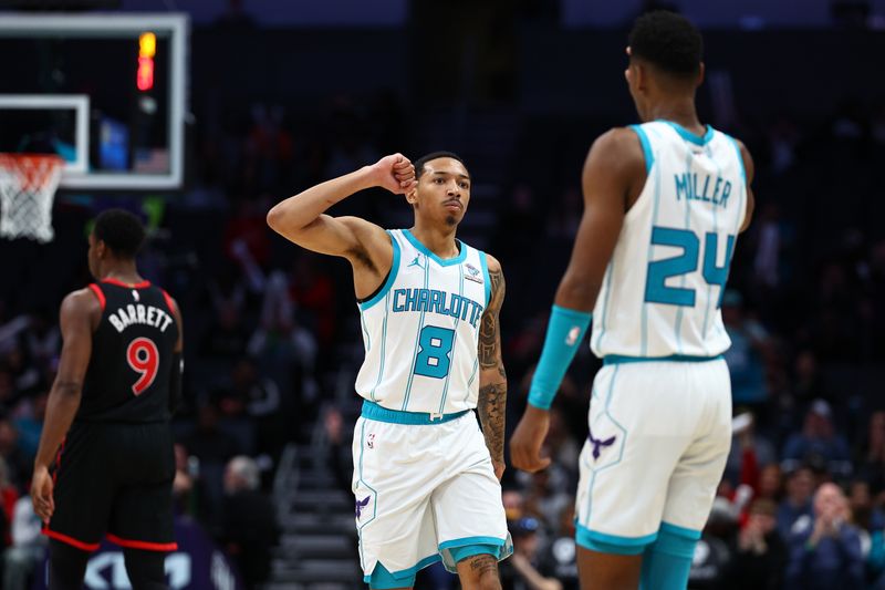 CHARLOTTE, NORTH CAROLINA - FEBRUARY 07: Nick Smith Jr. #8 and Brandon Miller #24 of the Charlotte Hornets react during the second half of the game against the Toronto Raptors at Spectrum Center on February 07, 2024 in Charlotte, North Carolina. NOTE TO USER: User expressly acknowledges and agrees that, by downloading and or using this photograph, User is consenting to the terms and conditions of the Getty Images License Agreement. (Photo by Jared C. Tilton/Getty Images)