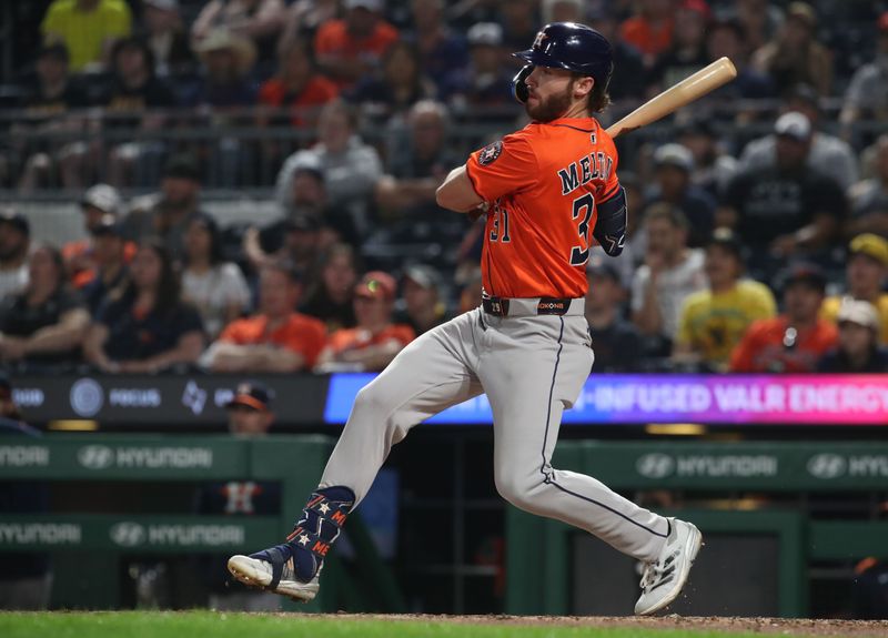 Jun 5, 2025; Pittsburgh, Pennsylvania, USA;  Houston Astros left fielder outfielder Jacob Melton (31) hits a two run single against the Pittsburgh Pirates during the fourth inning at PNC Park. Mandatory Credit: Charles LeClaire-Imagn Images