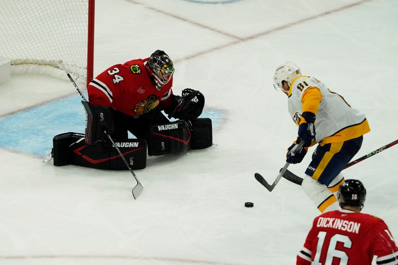 Oct 25, 2024; Chicago, Illinois, USA; Nashville Predators center Jonathan Marchessault (81) skates in on Chicago Blackhawks goaltender Petr Mrazek (34) during the second period at the United Center. Mandatory Credit: David Banks-Imagn Images