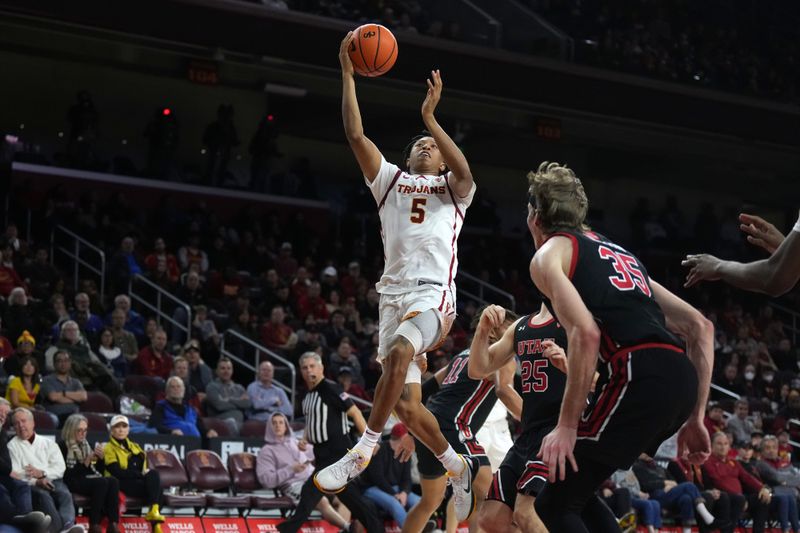 January 14, 2023; Los Angeles, California, USA; Southern California Trojans guard Boogie Ellis (5) shoots the ball against the Utah Utes in the second half at Galen Center. Mandatory Credit: Kirby Lee-USA TODAY Sports