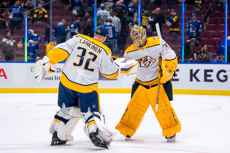 Apr 23, 2024; Vancouver, British Columbia, CAN;  Nashville Predators goalie Kevin Lankinen (32) and goalie Juuse Saros (74) celebrate their victory against the Vancouver Canucks in game two of the first round of the 2024 Stanley Cup Playoffs at Rogers Arena. Mandatory Credit: Bob Frid-USA TODAY Sports