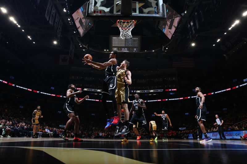 TORONTO, CANADA - FEBRUARY 22: Nicolas Claxton #33 of the Brooklyn Nets grabs the rebound during the game against the Toronto Raptors on February 22, 2024 at the Scotiabank Arena in Toronto, Ontario, Canada.  NOTE TO USER: User expressly acknowledges and agrees that, by downloading and or using this Photograph, user is consenting to the terms and conditions of the Getty Images License Agreement.  Mandatory Copyright Notice: Copyright 2024 NBAE (Photo by Vaughn Ridley/NBAE via Getty Images)