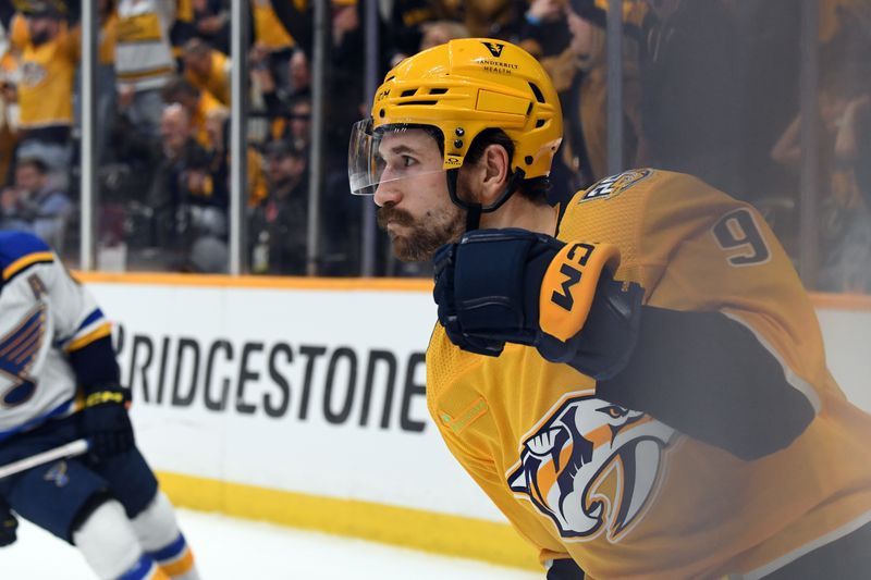 Apr 4, 2024; Nashville, Tennessee, USA; Nashville Predators left wing Filip Forsberg (9) celebrates after scoring an empty net goal during the third period against the St. Louis Blues at Bridgestone Arena. Mandatory Credit: Christopher Hanewinckel-USA TODAY Sports