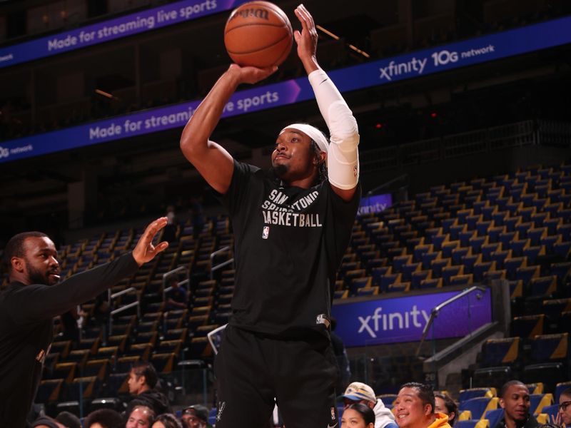 SAN FRANCISCO, CA - MARCH 9: Devonte Graham #4 of the San Antonio Spurs warms up before the game against the Golden State Warriors on March 9, 2024 at Chase Center in San Francisco, California. NOTE TO USER: User expressly acknowledges and agrees that, by downloading and or using this photograph, user is consenting to the terms and conditions of Getty Images License Agreement. Mandatory Copyright Notice: Copyright 2024 NBAE (Photo by Jed Jacobsohn/NBAE via Getty Images)