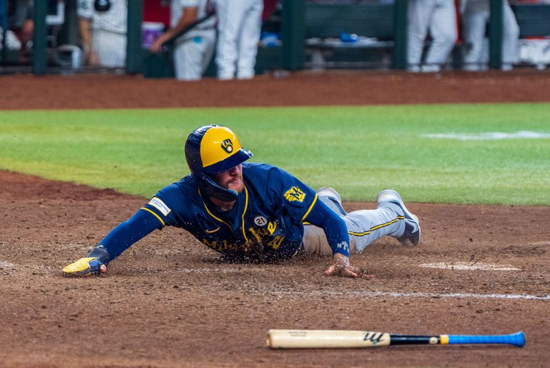 Sep 15, 2024; Phoenix, Arizona, USA; Milwaukee Brewers infielder Brice Turang (2) slides in to score in the tenth inning during a game against the Arizona Diamondbacks at Chase Field. Mandatory Credit: Allan Henry-Imagn Images