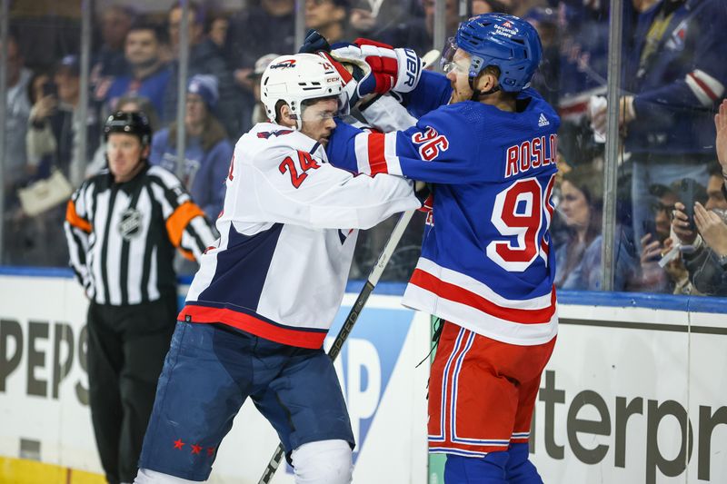 Apr 21, 2024; New York, New York, USA; Washington Capitals center Connor McMichael (24) and New York Rangers center Jack Roslovic (96) fight in the third period in game one of the first round of the 2024 Stanley Cup Playoffs at Madison Square Garden. Mandatory Credit: Wendell Cruz-USA TODAY Sports