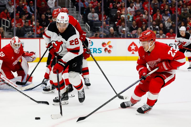 Oct 24, 2024; Detroit, Michigan, USA;  New Jersey Devils right wing Timo Meier (28) and Detroit Red Wings left wing Lucas Raymond (23) battle for the puck in the third period at Little Caesars Arena. Mandatory Credit: Rick Osentoski-Imagn Images