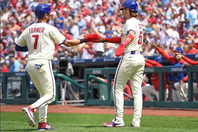 Apr 20, 2025; Philadelphia, Pennsylvania, USA; Philadelphia Phillies shortstop Trea Turner (7) and second base Bryson Stott (5) celebrate after scoring during the first inning against the Miami Marlins at Citizens Bank Park. Mandatory Credit: Eric Hartline-Imagn Images