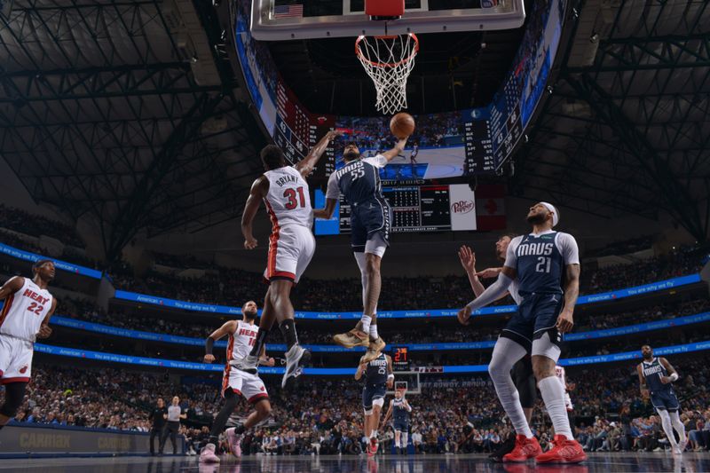 DALLAS, TX - MARCH 7: Derrick Jones Jr. #55 of the Dallas Mavericks dunks the ball during the game against the Miami Heat on March 7, 2024 at the American Airlines Center in Dallas, Texas. NOTE TO USER: User expressly acknowledges and agrees that, by downloading and or using this photograph, User is consenting to the terms and conditions of the Getty Images License Agreement. Mandatory Copyright Notice: Copyright 2024 NBAE (Photo by Glenn James/NBAE via Getty Images)