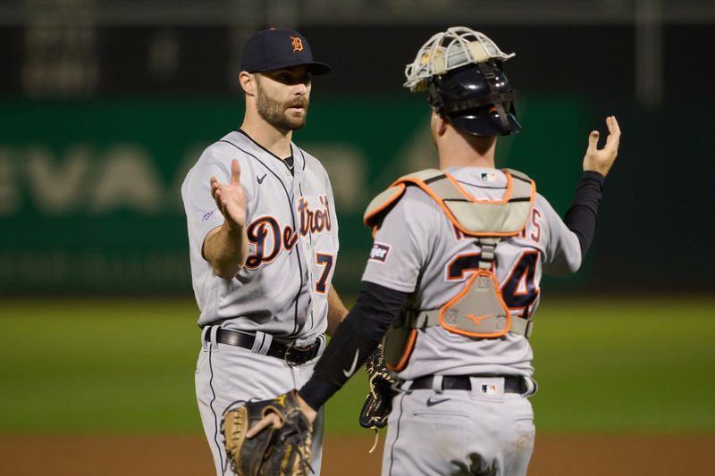 Sep 21, 2023; Oakland, California, USA; Detroit Tigers pitcher Brenan Hanifee (75) and catcher Jake Rogers (34) shake hands after the final out of the ninth inning against the Oakland Athletics at Oakland-Alameda County Coliseum. Mandatory Credit: Robert Edwards-USA TODAY Sports