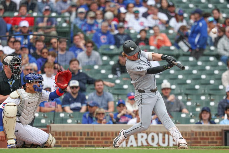 May 17, 2025; Chicago, Illinois, USA; Chicago White Sox shortstop Chase Meidroth (10) hits a solo home run against the Chicago Cubs during the first inning at Wrigley Field. Mandatory Credit: Kamil Krzaczynski-Imagn Images