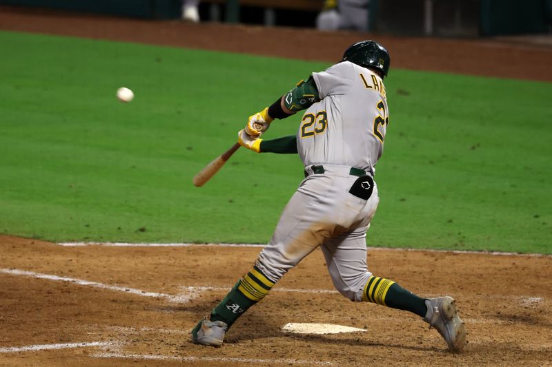 Sep 30, 2023; Anaheim, California, USA; Oakland Athletics catcher Shea Langeliers (23) hits a 3-run home run during the eighth inning against the Los Angeles Angels at Angel Stadium. Mandatory Credit: Kiyoshi Mio-USA TODAY Sports