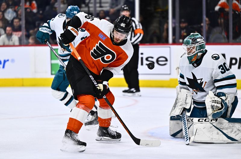 Mar 12, 2024; Philadelphia, Pennsylvania, USA; Philadelphia Flyers left wing Joel Farabee (86) deflects the puck against San Jose Sharks goalie Magnus Chrona (30) in the third period at Wells Fargo Center. Mandatory Credit: Kyle Ross-USA TODAY Sports