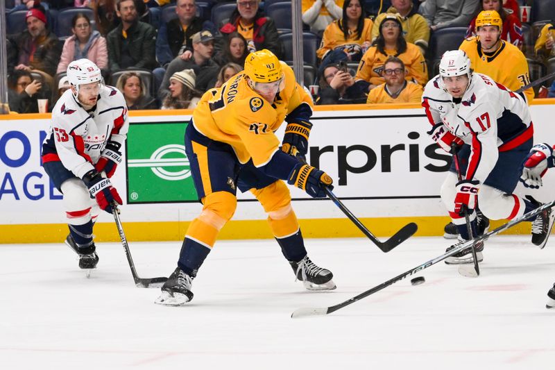 Jan 11, 2026; Nashville, Tennessee, USA;  Nashville Predators right wing Michael McCarron (47) takes a shot on goal against the Washington Capitals during the third period at Bridgestone Arena. Mandatory Credit: Steve Roberts-Imagn Images