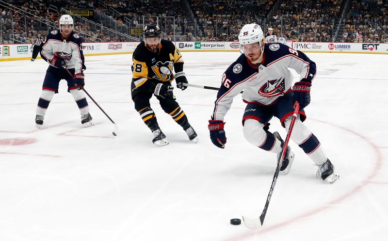 Mar 5, 2024; Pittsburgh, Pennsylvania, USA; Columbus Blue Jackets center Jack Roslovic (96) skates with the puck against the Pittsburgh Penguins during the second period at PPG Paints Arena. The Penguins won 5-3. Mandatory Credit: Charles LeClaire-USA TODAY Sports