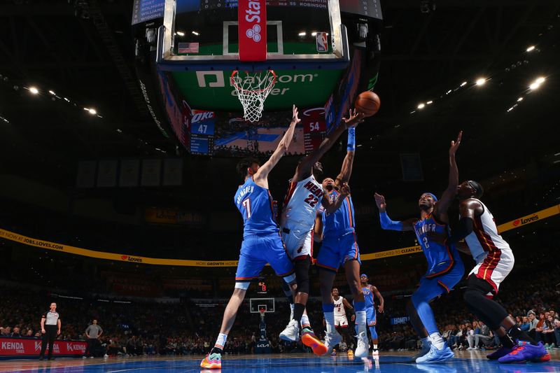 OKLAHOMA CITY, OK - MARCH 8:  Jimmy Butler #22 of the Miami Heat reaches for the ball during the game against the Oklahoma City Thunder on March 8, 2024 at Paycom Arena in Oklahoma City, Oklahoma. NOTE TO USER: User expressly acknowledges and agrees that, by downloading and or using this photograph, User is consenting to the terms and conditions of the Getty Images License Agreement. Mandatory Copyright Notice: Copyright 2024 NBAE (Photo by Zach Beeker/NBAE via Getty Images)