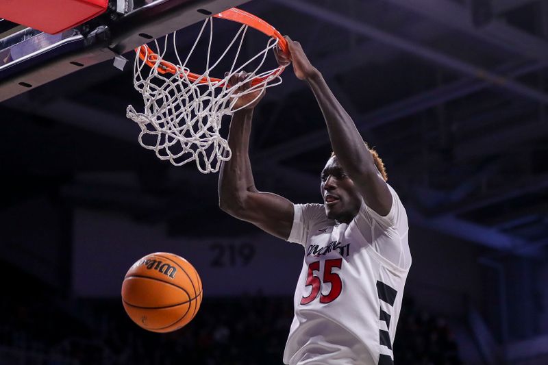 Dec 12, 2023; Cincinnati, Ohio, USA; Cincinnati Bearcats forward Aziz Bandaogo (55) dunks on the Bryant Bulldogs in the second half at Fifth Third Arena. Mandatory Credit: Katie Stratman-USA TODAY Sports