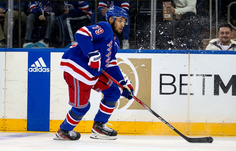 Jan 2, 2024; New York, New York, USA; New York Rangers defenseman K'Andre Miller (79) skates with the puck against the Carolina Hurricanes during the third period at Madison Square Garden. Mandatory Credit: Danny Wild-USA TODAY Sports