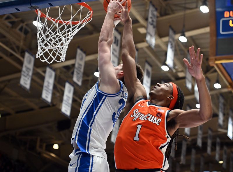 Jan 2, 2024; Durham, North Carolina, USA;  Duke Blue Devils center Kyle Filipowski (30) dunks in front of Syracuse Orange forward Maliq Brown (1) during the second half at Cameron Indoor Stadium.  The Blue Devils won 86-66. Mandatory Credit: Rob Kinnan-USA TODAY Sports