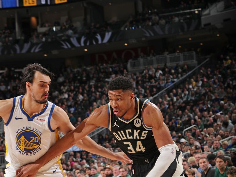 MILWAUKEE, WI - JANUARY 13: Giannis Antetokounmpo #34 of the Milwaukee Bucks dribbles the ball during the game against the Golden State Warriors on January 13, 2024 at the Fiserv Forum Center in Milwaukee, Wisconsin. NOTE TO USER: User expressly acknowledges and agrees that, by downloading and or using this Photograph, user is consenting to the terms and conditions of the Getty Images License Agreement. Mandatory Copyright Notice: Copyright 2024 NBAE (Photo by Gary Dineen/NBAE via Getty Images).