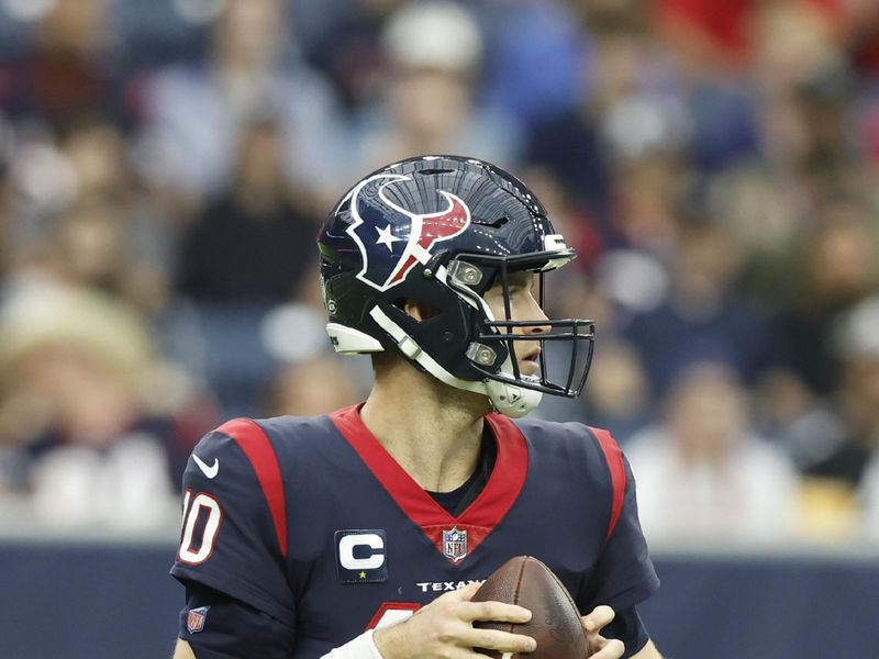 Houston Texans quarterback Davis Mills (10) looks to pass during an NFL football game against the Jacksonville Jaguars on Sunday, January 1, 2023, in Houston. (AP Photo/Matt Patterson)