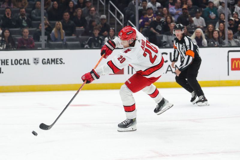 Oct 14, 2023; Los Angeles, California, USA; Carolina Hurricanes Center Sebastian Aho (20) takes a shot on goal during the third period at Crypto.com Arena. Mandatory Credit: Yannick Peterhans-USA TODAY Sports