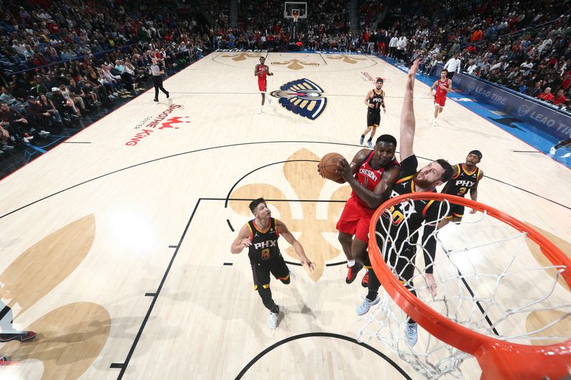 NEW ORLEANS, LA - APRIL 1:  Zion Williamson #1 of the New Orleans Pelicans drives to the basket during the game against the Phoenix Suns on April 1, 2024 at the Smoothie King Center in New Orleans, Louisiana. NOTE TO USER: User expressly acknowledges and agrees that, by downloading and or using this Photograph, user is consenting to the terms and conditions of the Getty Images License Agreement. Mandatory Copyright Notice: Copyright 2024 NBAE (Photo by Layne Murdoch Jr./NBAE via Getty Images)