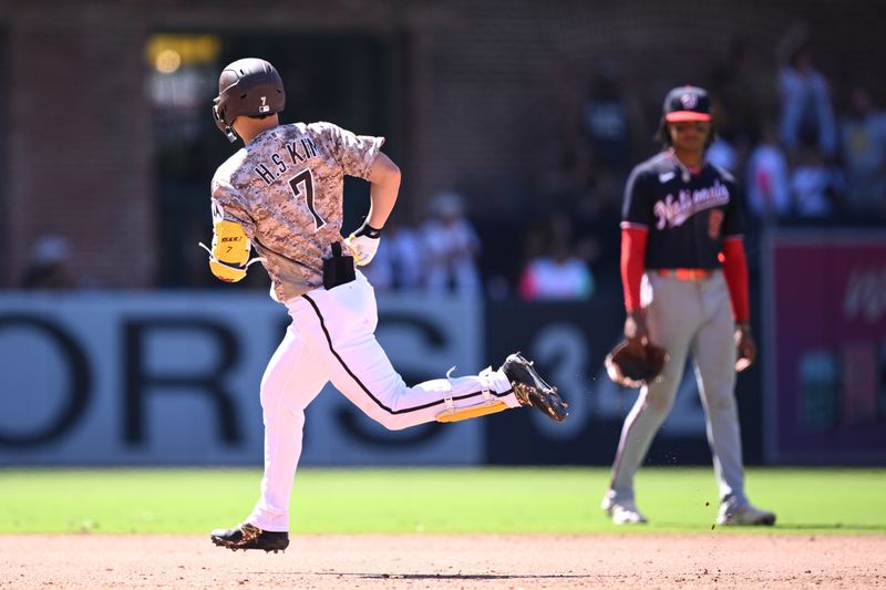 Jun 25, 2023; San Diego, California, USA; San Diego Padres second baseman Ha-seong Kim (7) rounds the bases past Washington Nationals shortstop C.J. Abrams (right) after hitting a home run during the seventh inning at Petco Park. Mandatory Credit: Orlando Ramirez-USA TODAY Sports