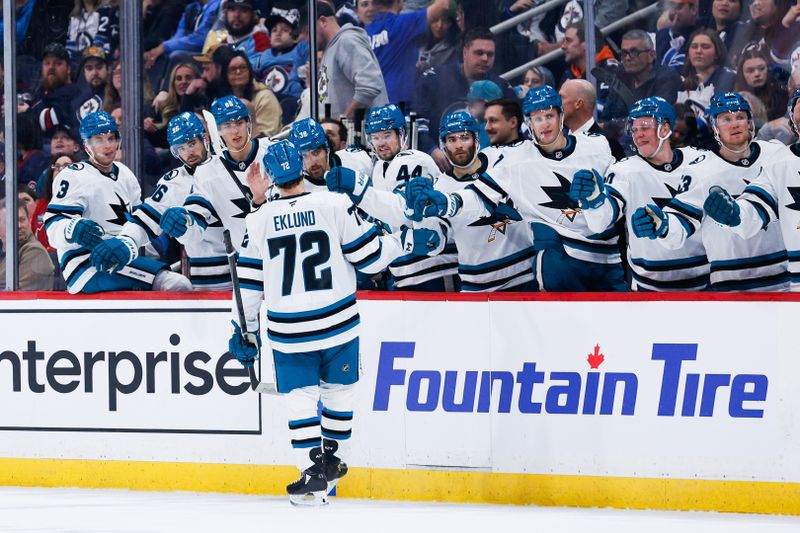 Feb 24, 2025; Winnipeg, Manitoba, CAN;  San Jose Sharks forward William Eklund (72) celebrates with teammates on his goal against the Winnipeg Jets during the first period at Canada Life Centre. Mandatory Credit: Terrence Lee-Imagn Images