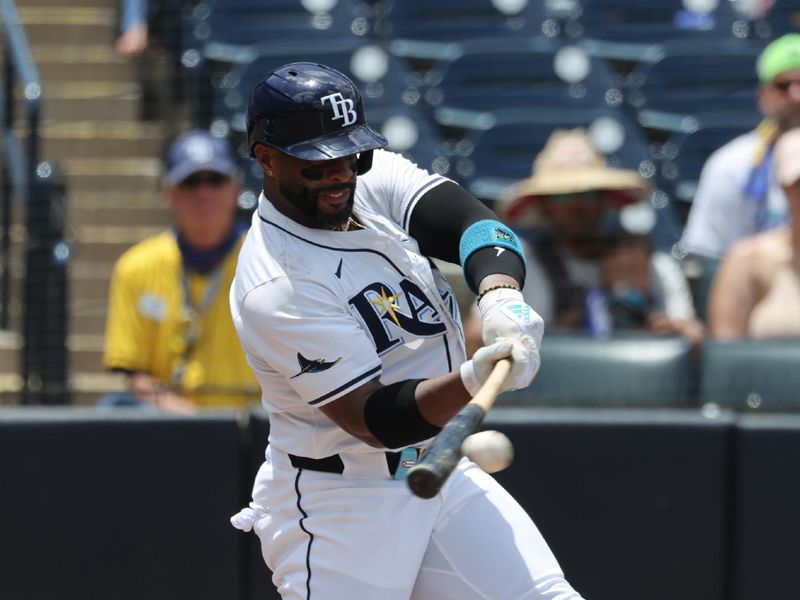 Jun 8, 2025; St. Petersburg, Florida, USA;  Tampa Bay Rays first baseman Yandy Diaz (2) doubles against the Miami Marlins against the Miami Marlins at George M. Steinbrenner Field. Mandatory Credit: Kim Klement Neitzel-Imagn Images