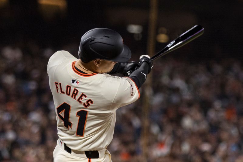 Jun 10, 2024; San Francisco, California, USA; San Francisco Giants first base Wilmer Flores (41) this a single against the Houston Astros during the ninth inning at Oracle Park. Mandatory Credit: John Hefti-USA TODAY Sports