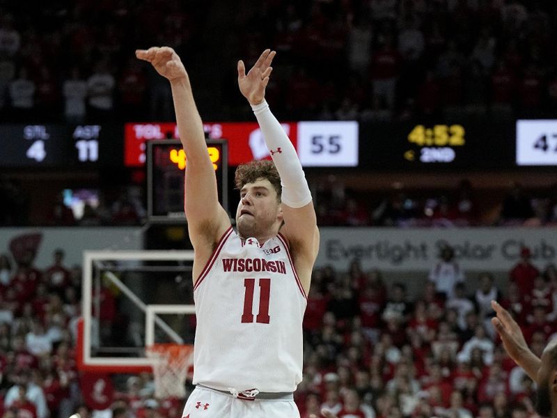 Feb 13, 2024; Madison, Wisconsin, USA;. Wisconsin guard Max Klesmit (11) misses a three-point shot during the second half of their game  at the Kohl Center. Mandatory Credit: Mark Hoffman/Milwaukee Journal Sentinelf-USA TODAY Sports
