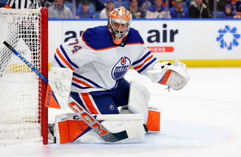 Mar 9, 2024; Buffalo, New York, USA;  Edmonton Oilers goaltender Stuart Skinner (74) looks for the puck during the second period against the Buffalo Sabres at KeyBank Center. Mandatory Credit: Timothy T. Ludwig-USA TODAY Sports