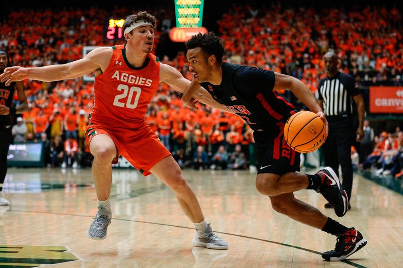 Jan 19, 2024; Fort Collins, Colorado, USA; UNLV Rebels guard Dedan Thomas Jr. (11) drives to the basket against Colorado State Rams guard Joe Palmer (20) in the first half at Moby Arena. Mandatory Credit: Isaiah J. Downing-USA TODAY Sports