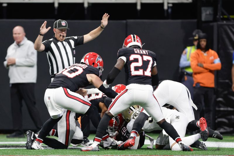 Atlanta Falcons wide receiver KhaDarel Hodge (12) recovers a fumble in the end zone for a touchdown during the first half of an NFL football game against the New Orleans Saints, Sunday, Sept. 29, 2024, in Atlanta. (AP Photo/Stew Milne)