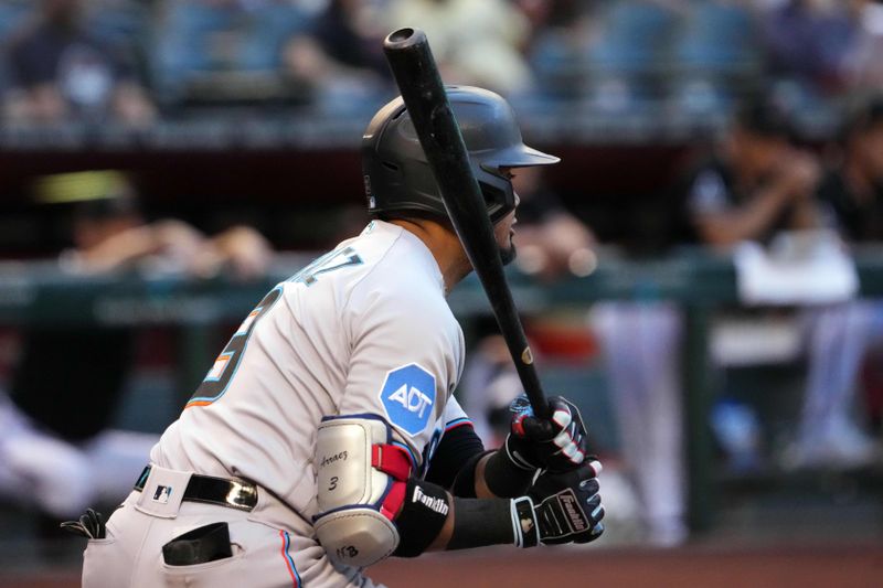 May 9, 2023; Phoenix, Arizona, USA; Miami Marlins second baseman Luis Arraez (3) hits an RBI single against the Arizona Diamondbacks during the first inning at Chase Field. Mandatory Credit: Joe Camporeale-USA TODAY Sports