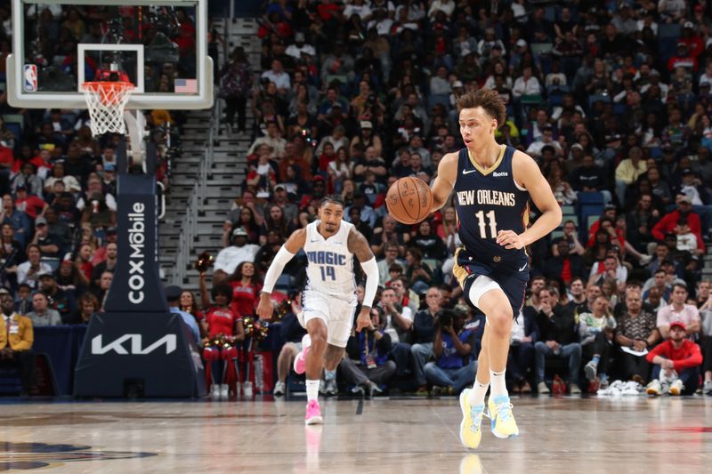 NEW ORLEANS, LA - APRIL 3:  Dyson Daniels #11 of the New Orleans Pelicans handles the ball during the game against the Orlando Magic on April 3, 2024 at the Smoothie King Center in New Orleans, Louisiana. NOTE TO USER: User expressly acknowledges and agrees that, by downloading and or using this Photograph, user is consenting to the terms and conditions of the Getty Images License Agreement. Mandatory Copyright Notice: Copyright 2024 NBAE (Photo by Layne Murdoch Jr./NBAE via Getty Images)