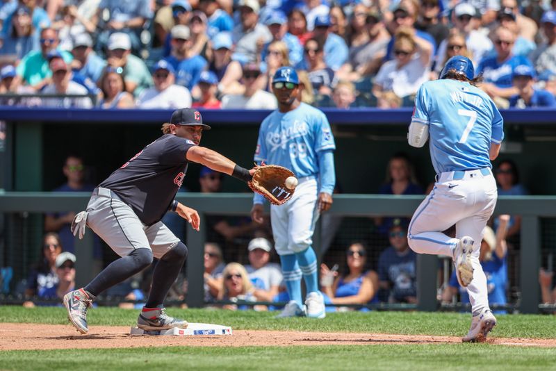 Jun 30, 2024; Kansas City, Missouri, USA; Cleveland Guardians first base Josh Naylor (22) reaches for a throw around Kansas City Royals shortstop Bobby Witt Jr. (7) at first base during the seventh inning at Kauffman Stadium. Mandatory Credit: William Purnell-USA TODAY Sports