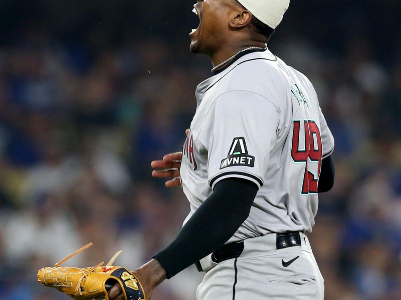 Jul 4, 2024; Los Angeles, California, USA; Arizona Diamondbacks pitcher Thyago Vieira (49) reacts after a strikeout to end the game against the Los Angeles Dodgers at Dodger Stadium. Mandatory Credit: Jason Parkhurst-USA TODAY Sports