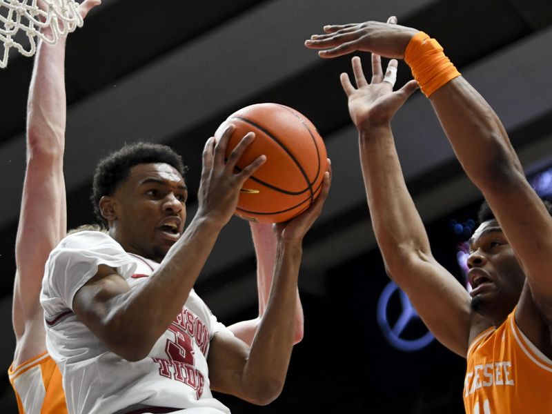 Mar 2, 2024; Tuscaloosa, Alabama, USA; Alabama guard Rylan Griffen (3) tries to pass after driving into the lane and being defined by Tennessee forward Tobe Awaka (11) at Coleman Coliseum. Mandatory Credit: Gary Cosby Jr.-USA TODAY Sports