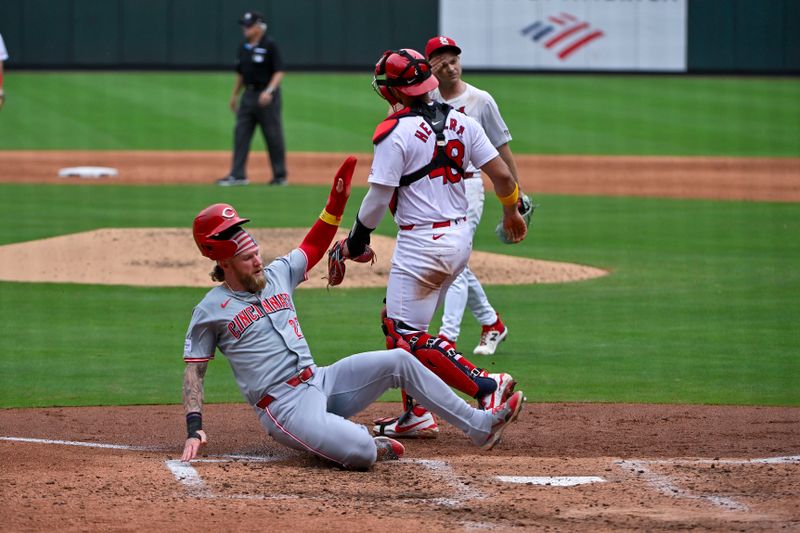 Sep 12, 2024; St. Louis, Missouri, USA;  Cincinnati Reds right fielder Jake Fraley (27) slides safely in at home to score against the St. Louis Cardinals during the sixth inning at Busch Stadium. Mandatory Credit: Jeff Curry-Imagn Images