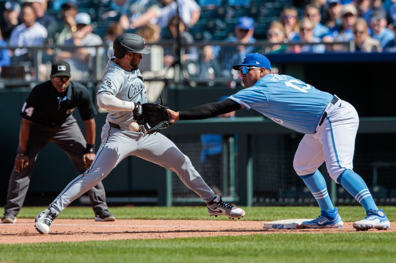 Apr 7, 2024; Kansas City, Missouri, USA; Kansas City Royals catcher Salvador Perez (13) reaches for a throw as Chicago White Sox second base Lenyn Sosa (50) reaches for first base during the eighth inning at Kauffman Stadium. Mandatory Credit: William Purnell-USA TODAY Sports