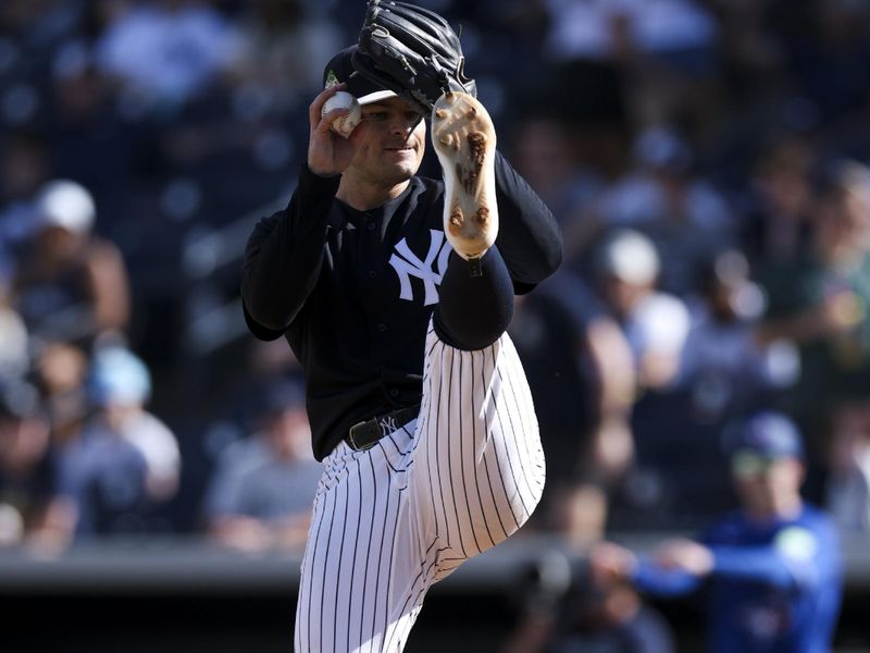 Feb 28, 2026; Tampa, Florida, USA; New York Yankees pitcher Harrison Cohen (77) throws a pitch against the Toronto Blue Jays in the ninth inning during spring training at George M. Steinbrenner Field. Mandatory Credit: Nathan Ray Seebeck-Imagn Images
