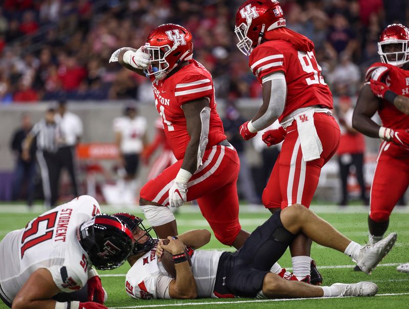 Sep 4, 2021; Houston, Texas, USA; Houston Cougars defensive lineman D'Anthony Jones (44) reacts after sacking Texas Tech Red Raiders quarterback Tyler Shough (12) during the first half at NRG Stadium. Mandatory Credit: Troy Taormina-USA TODAY Sports