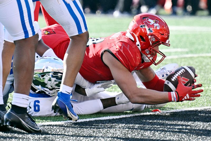 Nov 25, 2023; Louisville, Kentucky, USA;  Louisville Cardinals tight end Joey Gatewood (84) lunges across the goal line to score a touchdown against the Kentucky Wildcats during the second half at L&N Federal Credit Union Stadium. Kentucky defeated Louisville 38-31. Mandatory Credit: Jamie Rhodes-USA TODAY Sports