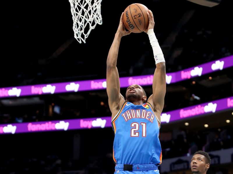 CHARLOTTE, NC - OCTOBER 15: Aaron Wiggins #21 of the Oklahoma City Thunder dunks the ball during the game against the Charlotte Hornets on October 15, 2023 at Spectrum Center in Charlotte, North Carolina. NOTE TO USER: User expressly acknowledges and agrees that, by downloading and or using this photograph, User is consenting to the terms and conditions of the Getty Images License Agreement.  Mandatory Copyright Notice:  Copyright 2023 NBAE (Photo by Brock Williams-Smith/NBAE via Getty Images)