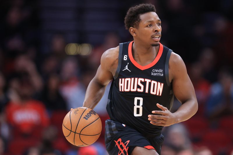 HOUSTON, TEXAS - JANUARY 18: Jae'Sean Tate #8 of the Houston Rockets controls the ball against the Charlotte Hornets during the first half at Toyota Center on January 18, 2023 in Houston, Texas. NOTE TO USER: User expressly acknowledges and agrees that, by downloading and or using this photograph, User is consenting to the terms and conditions of the Getty Images License Agreement. (Photo by Carmen Mandato/Getty Images)