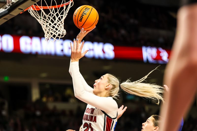 Jan 15, 2024; Columbia, South Carolina, USA; South Carolina Gamecocks forward Chloe Kitts (21) drives against the Kentucky Wildcats in the first half at Colonial Life Arena. Mandatory Credit: Jeff Blake-USA TODAY Sports