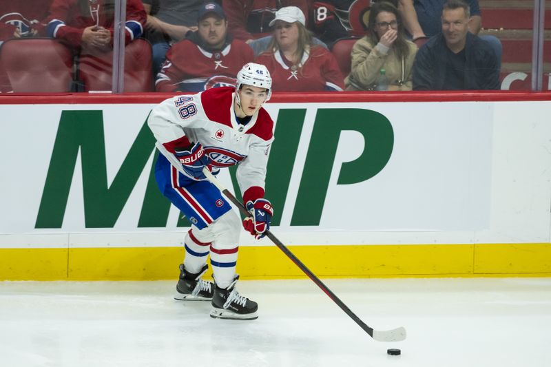 Apr 11, 2025; Ottawa, Ontario, CAN; Montreal Canadiens defenseman Lane Hutson (48) skates with the puck in the third period against the Ottawa Senators at the Canadian Tire Centre. Mandatory Credit: Marc DesRosiers-Imagn Images